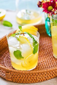 Lemonade with fresh lemon and mint by lemon reamer