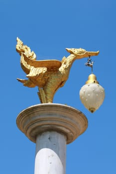 The lamp in mouth of bird.They have design from thai art pattern.