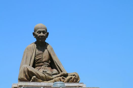 The large statue of kruba Siwichai is located in the public garden in the area of temple.