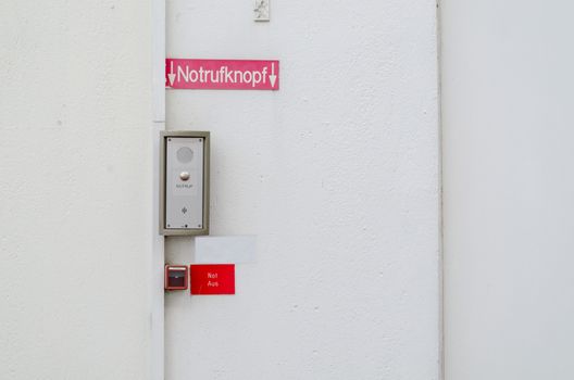 Emergency button, fire alarm and burglar alarm at a building
