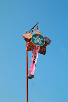 Traditional paper lantern is hanging on the pole.