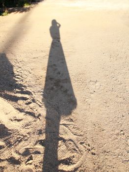 shadow of photographer cast on the ground.