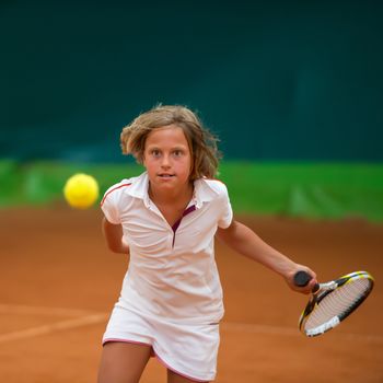 Children at school during a dribble of tennis