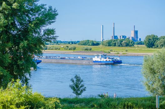 A tanker slowly plows through the water.