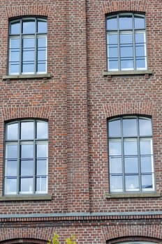 Gable view of a historic old house made ​​of brick.