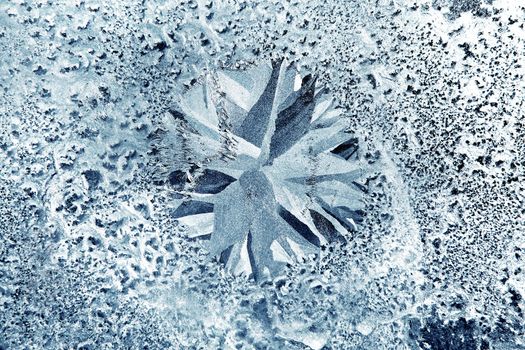 Ice Pattern on the Frozen Window Glass Closeup