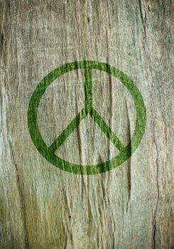 Peace sign printed on a tree trunk