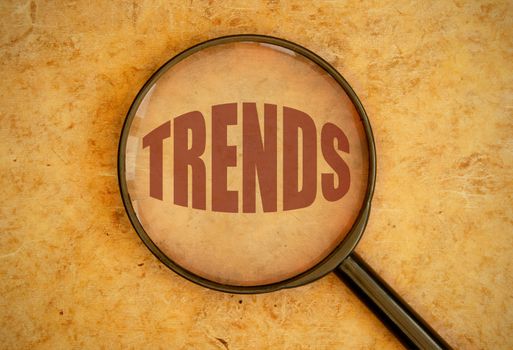 Magnifying glass focusing on trends