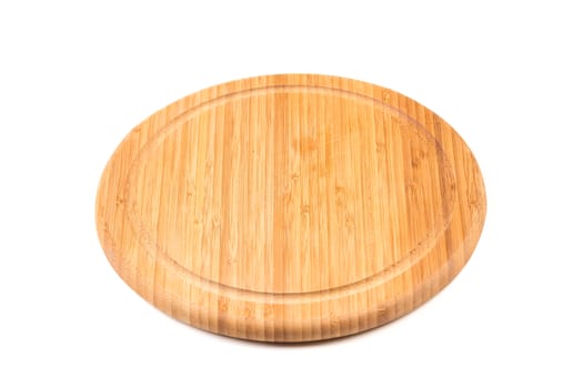 Round Bamboo Chopping Board from low perspective isolated against white background.