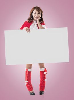 Asian Christmas girl holding a blank board, full length portrait.