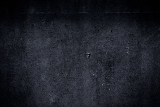 Very dark and grungy concrete wall and floor as background texture