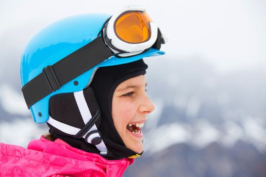 Ski, skier, winter - closeup portrait of lovely girl has a fun on ski