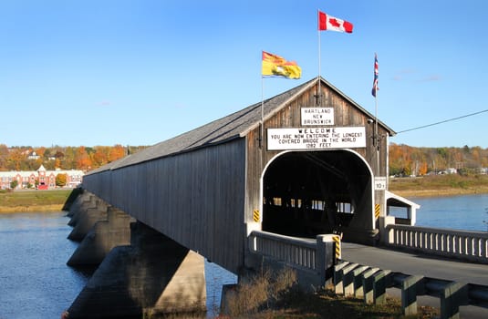 The longest wooden covered bridge in the world located in Hartland, New Brunwick, Canada in Autumn time