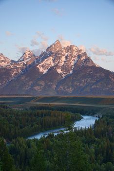 morning sunlight over Grand Tetons at a snake river overlook