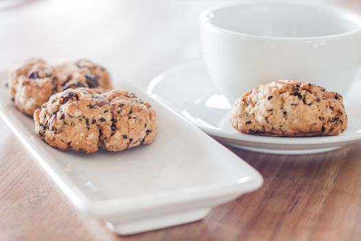 Coffee cup and mixed nut cookies, stock photo