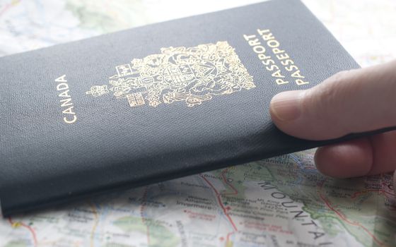 People carrying passport and map ready to travel.