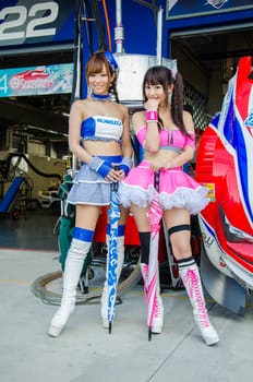 BURIRAM - OCTOBER 4: Unidentified  Race Queen of Japan with racing car on display at The 2014 Autobacs Super GT Series Race 7 on October 4, 2014 at Chang International Racing Circuit, Buriram Thailand