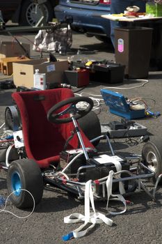 Santa Pod, UK - April 23, 2010: Alternative energy racing at Santa Pod Raceway. A battery powered go kart undergoing maintenance before test runs down a quarter mile drag strip.