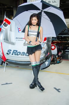 BURIRAM - OCTOBER 4: Unidentified  Race Queen of Japan with racing car on display at The 2014 Autobacs Super GT Series Race 7 on October 4, 2014 at Chang International Racing Circuit, Buriram Thailand