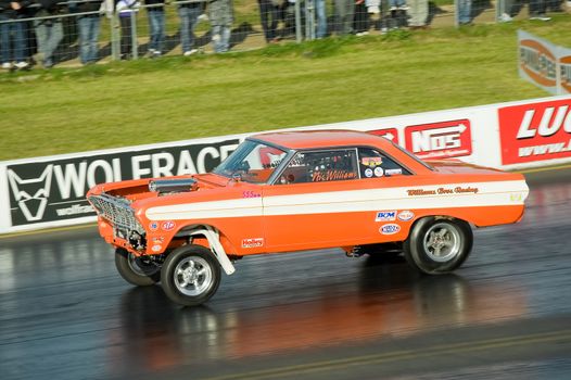 Santa Pod, UK - October 29, 2011: Pro modified Ford Falcon hotrod at the Flame and Thunder race event on at Santa Pod Raceway in Northamptonshire, UK