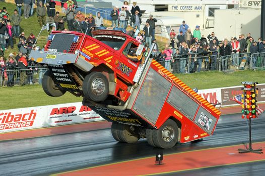 Santa Pod, UK - October 29, 2011: Backdraft Wheelie Truck demonstration at the Flame and Thunder event at Santa Pod Raceway in Northamptonshire, UK