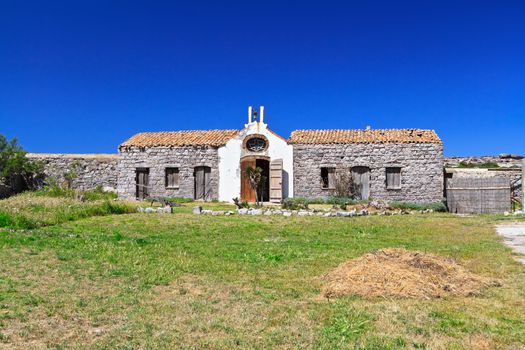 ancient small chapel in San Pietro island, Sardinia, Italy