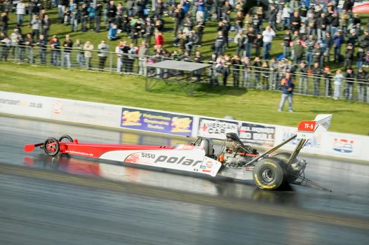 Santa Pod, UK - October 29, 2011: High speed run by the Susi Polar top fuel dragster at the Flame and Thunder event at Santa Pod Raceway in Northamptonshire, UK