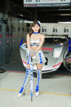BURIRAM - OCTOBER 5: Unidentified Race Queen of Japan with racing car on display at The 2014 Autobacs Super GT Series Race 7 on October 5, 2014 at Chang International Racing Circuit, Buriram Thailand