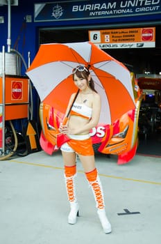 BURIRAM - OCTOBER 5: Unidentified Race Queen of Japan with racing car on display at The 2014 Autobacs Super GT Series Race 7 on October 5, 2014 at Chang International Racing Circuit, Buriram Thailand