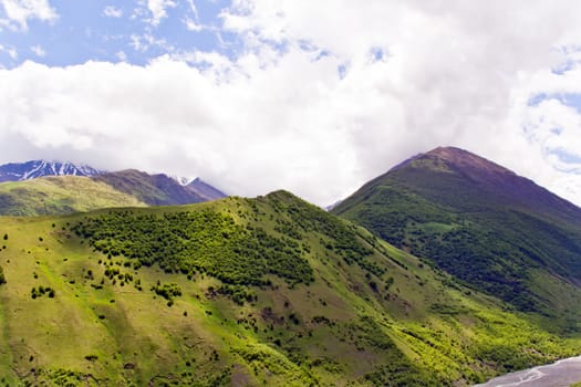 Summer landscape with Russian Caucasus green mountains