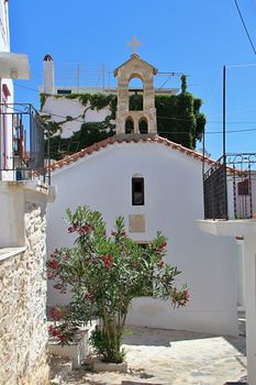 Photo shows Greek old village houses and their surroundings.