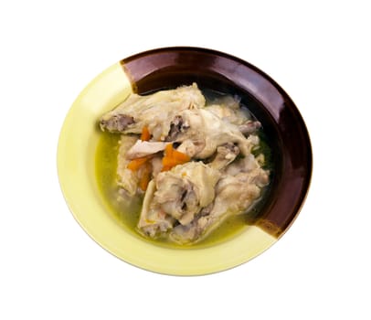 Appetizing boiled chicken legs in a plate on a white background