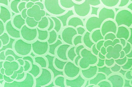 Abstract green circle fabric texture and background.