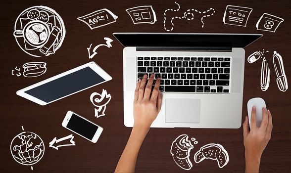 Hand operating laptop, technology background