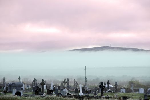 Fog rolling into the graveyard next to Ballybunion golf course in county Kerry Ireland