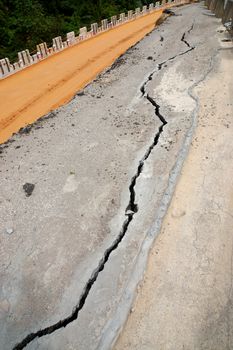 the asphalt road surface crack due to ground collapsing.