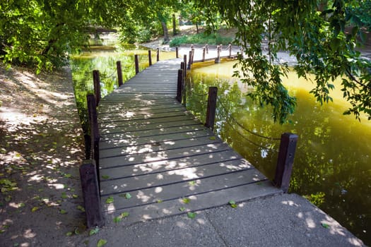 Wood bridge over the defense lake surrounding Vajdahunyad Castle, Budapest, Hungary