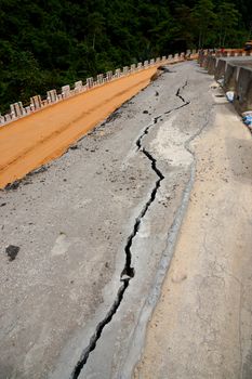 the asphalt road surface crack due to ground collapsing.