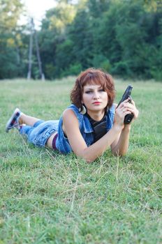 girl with gun on nature