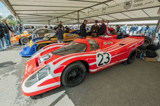 Goodwood, UK - July 1, 2012: Collection of classic Porsche racing sports cars in the service pits at the Festival of Speed motor-sport event held at Goodwood, UK