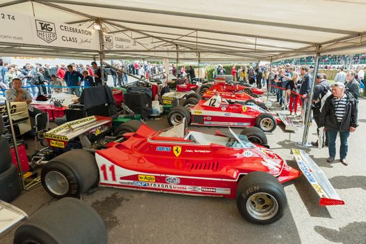 Goodwood, UK - July 1, 2012: Collection of classic Ferrari F1 racing cars in the service pits at the Festival of Speed motor-sport event held at Goodwood, UK