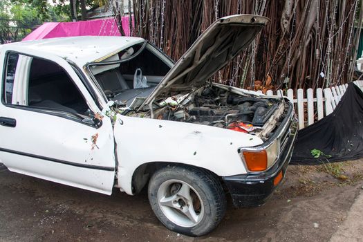 tree on a car after hurricane (damaged car)