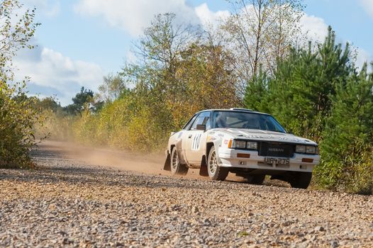 Aldershot, UK - November 3, 2012: Ian Robertson driving a classic Nissan 240RS on the Pavillion stage of the MSA Tempest Rally near Aldershot, UK