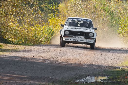 Aldershot, UK - November 3, 2012: Ford Escort RS at speed on the Pavillion stage of the MSA Tempest Rally near Aldershot, UK