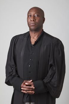 bald black man wearing a preacher toga