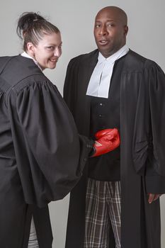 a woman lawyer punching a man lawyer into the guts