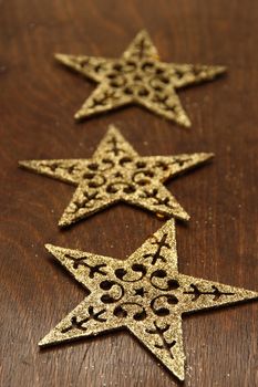 Christmas decorations.  three stars on wooden background