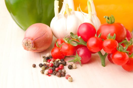 Photo shows a detail of the colourful vegetable on a table.