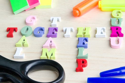 Photo shows a detail of the crossword puzzle funny sign with symbols on a table.