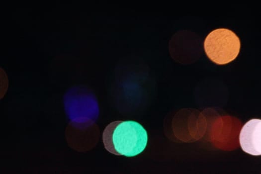 Dark background with multi-colored spots